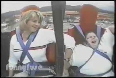 Fat kid almost falls off of ride