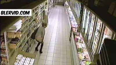 Woman in a supermarket. Guess what she does....