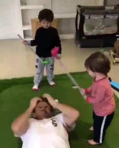 Let your kids hit a ball off your head