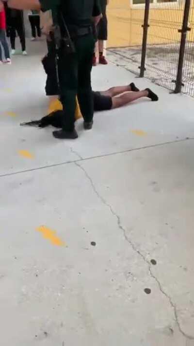 Police officer body slamming a female high school student in Osceola county, FL.