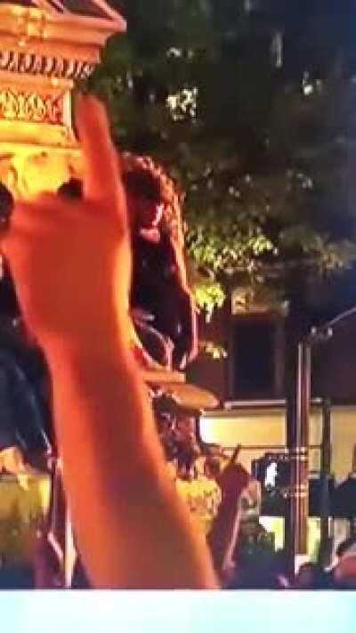 Protestors break a statue and it falls on some guy's head. D or V?