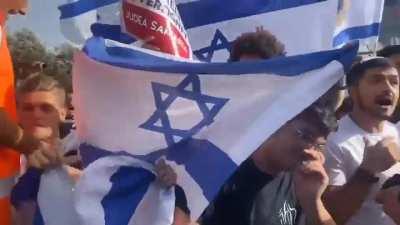 Jewish settler mob protected by the Israeli military and police have gathered outside a Palestinian neighborhood shouting 