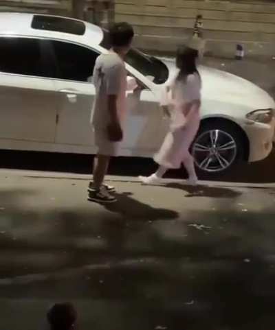 Dude let's woman slap him twice but knocks her out when she touches his car.