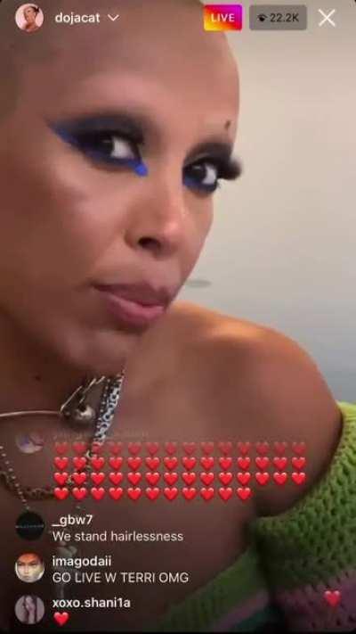 Doja Cat shows off her new look. shaved eyebrows and a Bald head