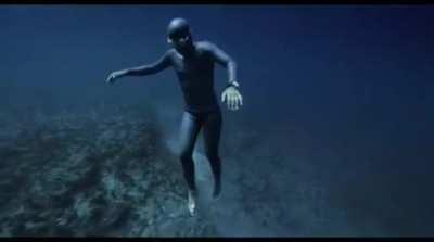 Diver gets caught in an undersea current.