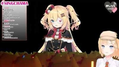 Haachama sings We Will Rock You, but the beat is Amelia slamming her desk.