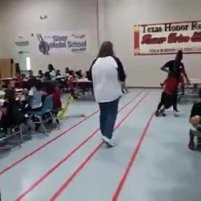 Woman ass- whoops son for not behaving in the class