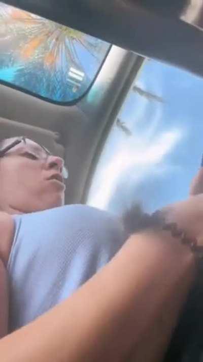 Lady decided to pick up a wild squirrel from the road.