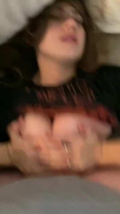 Eagerly awaiting his load as she lies back and has her tits pumped