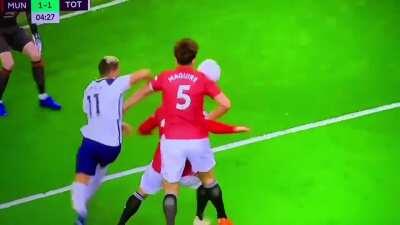 Harry Maguire pulling down Luke Shaw while he was about to clear the ball before Tottenham's equalizer
