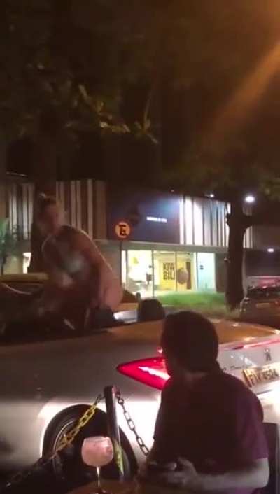 Throwing trash at a woman in a bikini