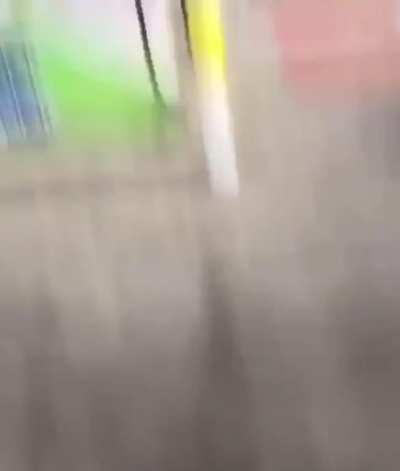 Dumbass shooting Roman candles (fireworks) in a gas station lot