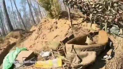 A Ukrainian soldier tries to shoot down a Russian FPV drone near Kreminna, Luhansk region.