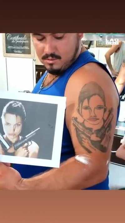 Guy gets an Angelina Jolie tattoo