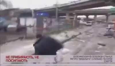 Owner of a small retail spot pushes a news crew reporting unsafe, slippery sidewalks