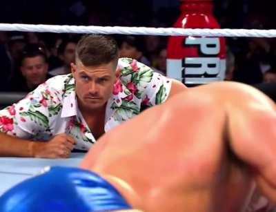 Grayson Waller trying not to look at Austin Theory’s fat ass 