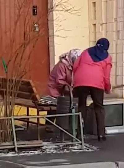 TV getting a beat down by two babushkas