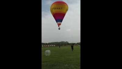 Someone falls from a hot air balloon.