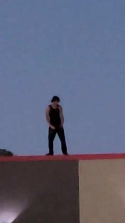 Dude jammin out to Walk by Pantera on the roof of a Burger King...