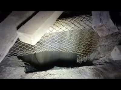 Throwing a piece of metal down a several-thousand foot deep borehole in abandoned mine.