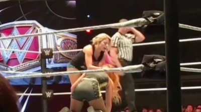 Becky punching Alexa bliss in the belly