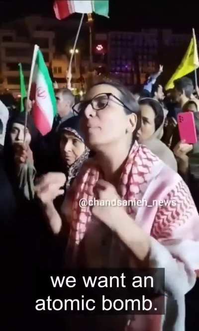 An Iranian woman demands the government to build atomic bombs