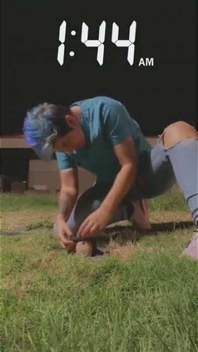 Woman frees stuck frog/toad from reticulation valve cover