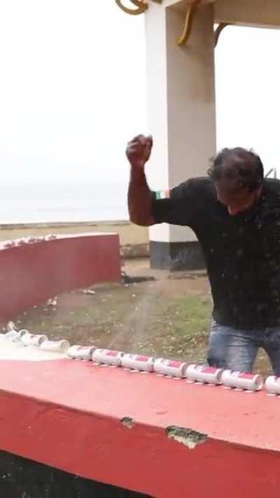 John Paul K R sets a Guinness World Record by the Most drinks cans crushed while holding an egg in 30 secs! He did 52!!!