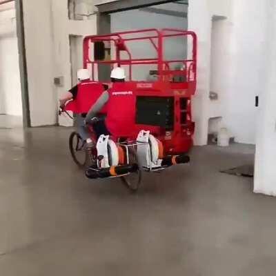 Using leaf blowers attached to a bike to get around a warehouse