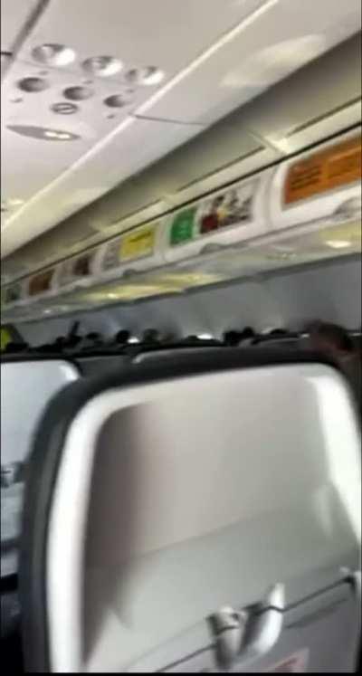 She has inflight entertainment covered…. Or uncovered