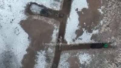 Ukrainian drone drops F1 grenade into Russian trench. (date and location unknown)