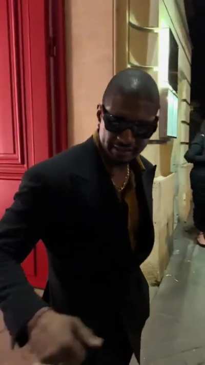 Usher goes viral for awkward moment with doorman as he leaves a dinner at the Baccarat Hotel in Paris