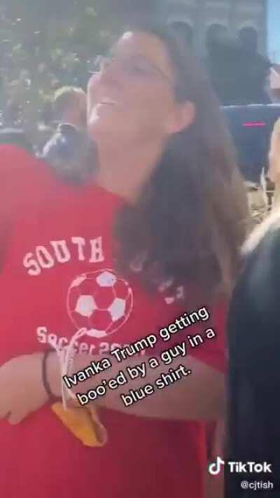 Ivanka Trump being loudly booed by a man in a blue shirt