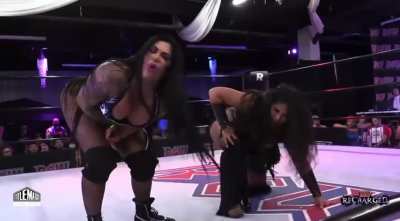 Katie Forbes takes an atomic drop by Claudia Del Solis