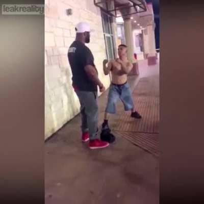 A shirtless drunk takes on a man twice his size