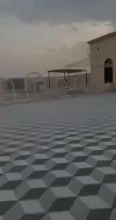 Some Arab blokes messing around with their friend