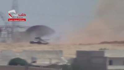 Syrian Army T-55 takes a direct anti-tank strike &amp;amp; beats a hasty retreat - al-Rashideen, Aleppo - 7/7/2013