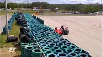 Spring falls of car and hits driver of car behind at 250kph (155mph) knocking him unconscious