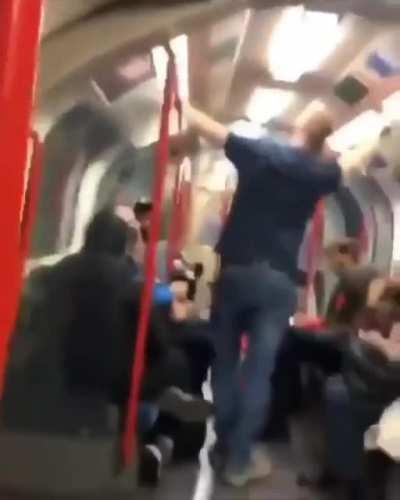 Man harassing woman on the train before other passengers intervene