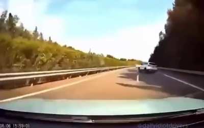 An suv is trying to exit from the passing lane