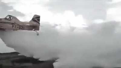 Wing collapse on a crop dusting plane flying over a field 2021