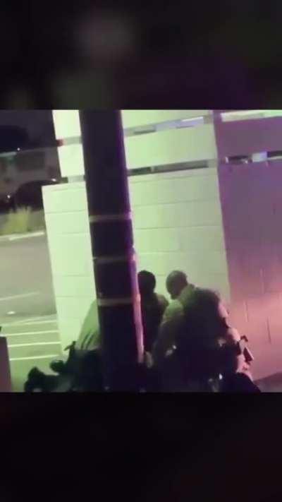 Cops take a civilian behind a wall to beat him. Apparently, he wasn’t even apart of a protest and was trying to get home