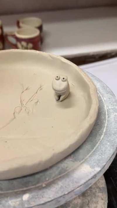 Flowers, a frog, a silly hat. Nature-inspired ceramics that had a sudden turn of whimsy. 🐸