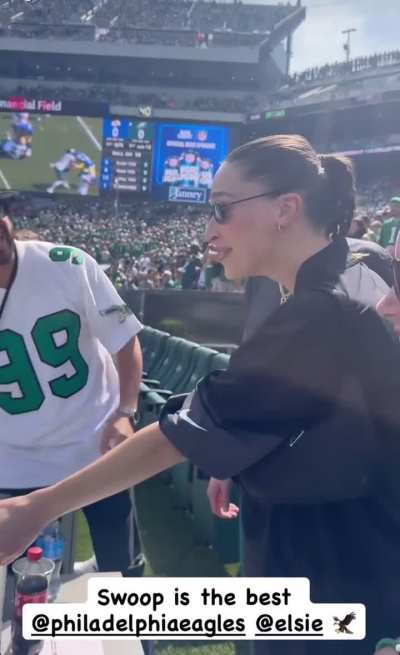 Elsie being gifted a baby stuffed eagle by the Philadelphia Eagles’s mascot ‘Swoop’ while she & pete attended the game