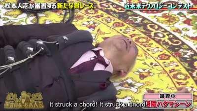 Matsumoto tries the hug machine.