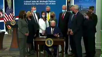 Biden on signing a bill. 