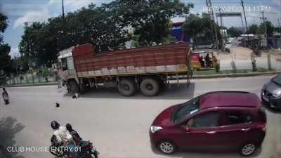 Biker Loses Control, Gets Crushed By Truck