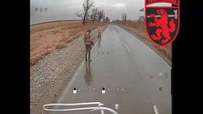 For some reasons Russian soldiers mistakenly believe that remaining still at the open space would allow them to avoid detection by a Ukrainian drone.