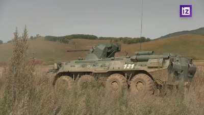 RU POV: Mobilized Russian soldiers training with tanks and APCs.