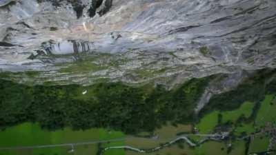 Base jumper and climbing legend free soloing except this time he is wearing a base jumping rig on his back just in case. This time it came in handy. 